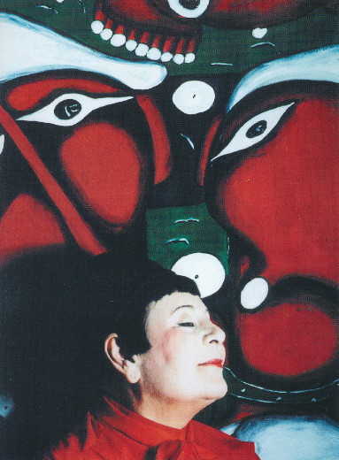Image -- Emma Andiievska and her painting.