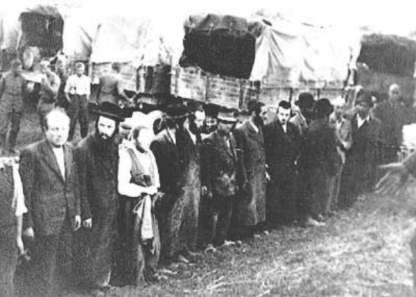 Image -- Jews awaiting deportation in Brody (1943).