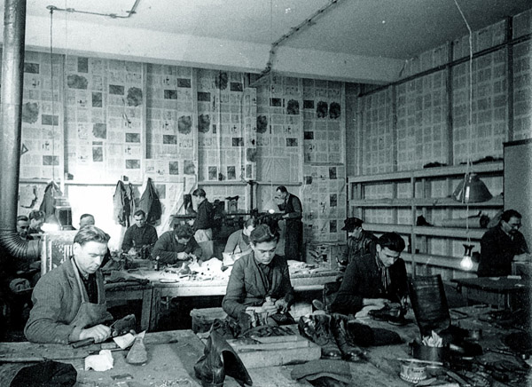 Image -- A Ukrainian shoemakers workshop in a displaced persons camp in Germany.