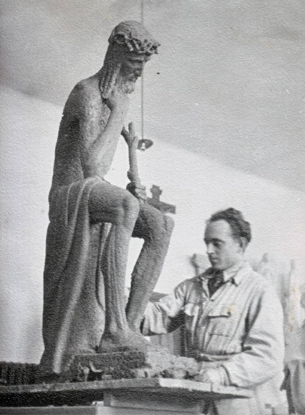 Image -- Yevhen Dzyndra working on his sculpture of Christ (1938).