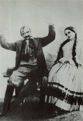 Image -- Yosyp Hirniak and Valentyna Chystiakova in Les Kurbas' production of M. Kulish's Peoples Malakhii in Berezil (1928).