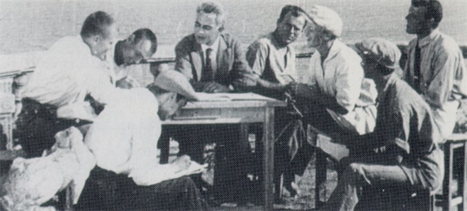 Image -- Les Kurbas with a group of Berezil actors during his work on two film productions Vendetta and McDonald (Odesa, 1924).