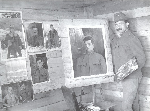 Image -- Osyp Kurylas with his paintings.