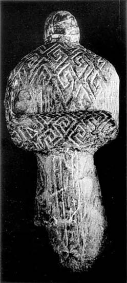Image -- Mizyn archeological site (the late Paleolithic Period): mammoth bone statuette.