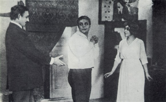 Image -- Les Kurbas, Marko Tereshchenko, and Olimpiiia Dobrovolska in the Molodyi Teatr production of Max Halbe's Youth (1919).
