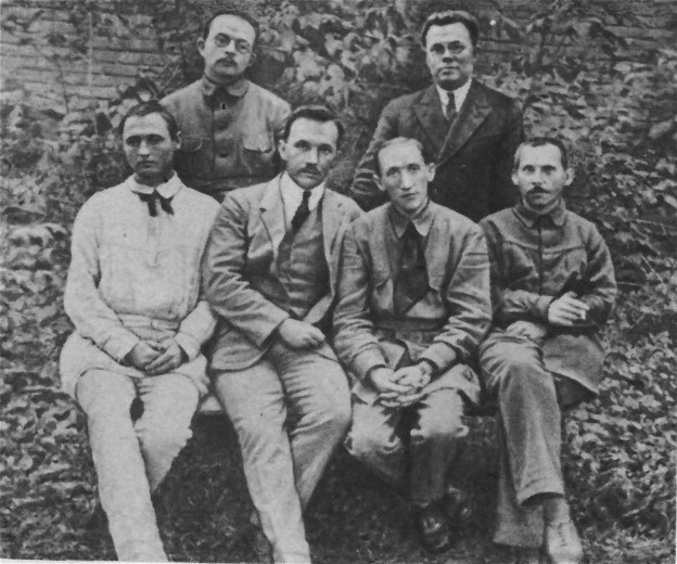 Image -- The Neoclassicists: (1920s photo): standing (l-r), V. Petrov and M. Zerov; sitting, O. Burghardt (Yu. Klen), P. Fylypovych, B. Yakubsky, M. Rylsky.