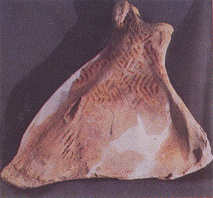Image -- Ornament: late Paleolithic zigzag ornament in red ochre on a mammoth shoulder bone (excavated in Mizyn, Chernihiv oblast).