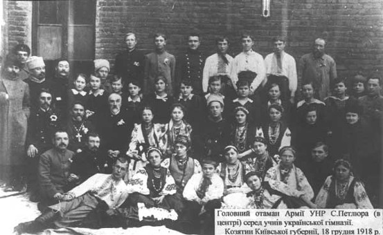 Image -- Symon Petliura among students of the Ukrainian gymnasium in Koziatyn (1918).