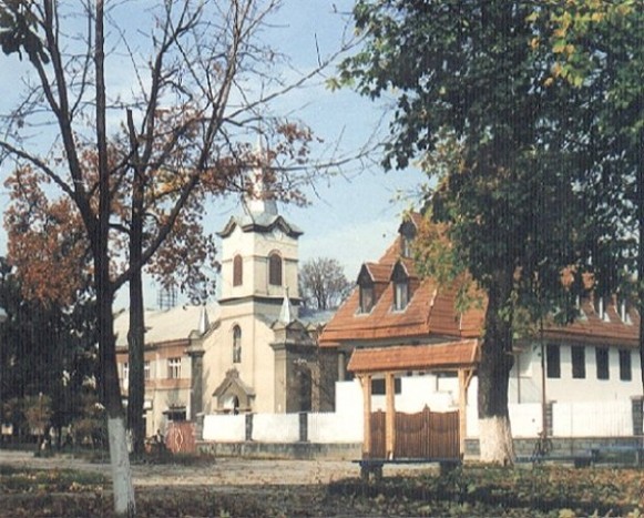 Image -- Tiachiv: The Protestant Church (13th century, rebuilt in 18th century) and the parish building.